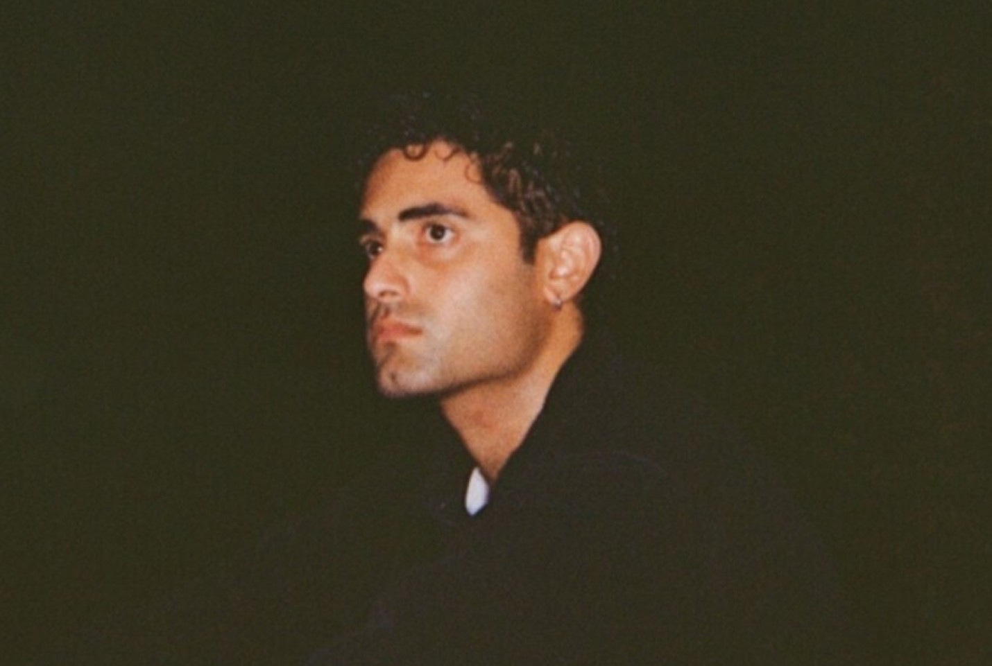 Ashley Singh looking into the distance.
